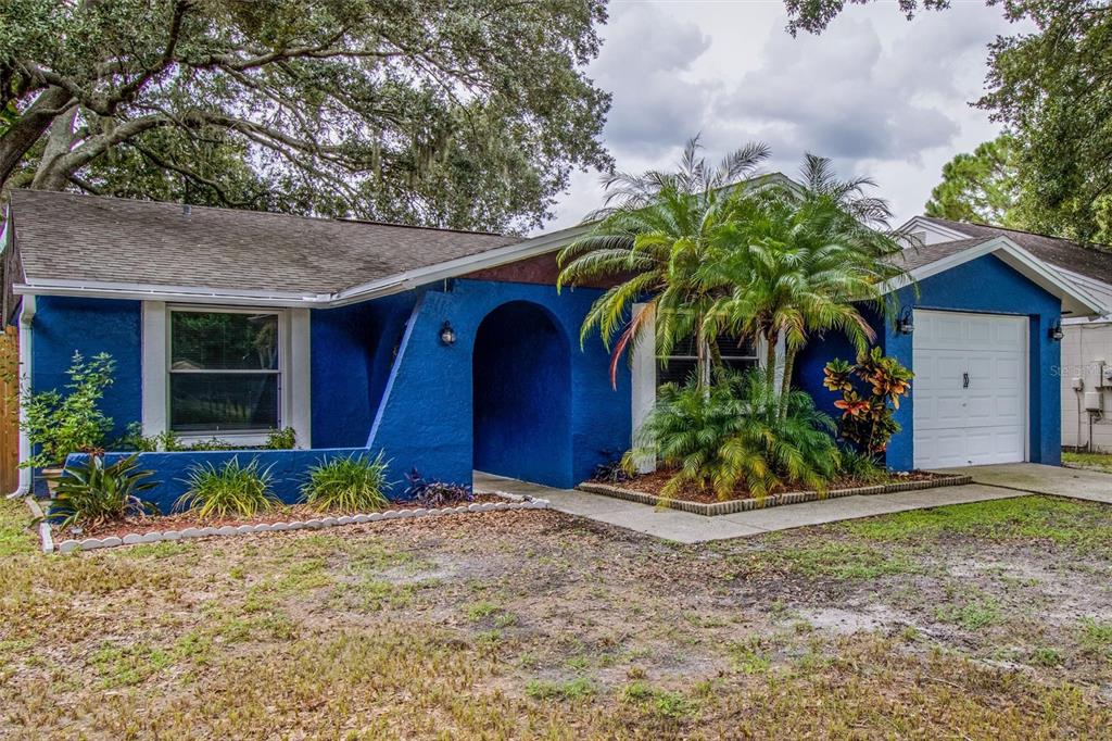 front view of a house with a yard