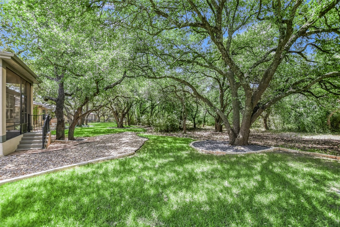 Nestled against a serene treed greenbelt, this residence embodies the amazing Sun City lifestyle.