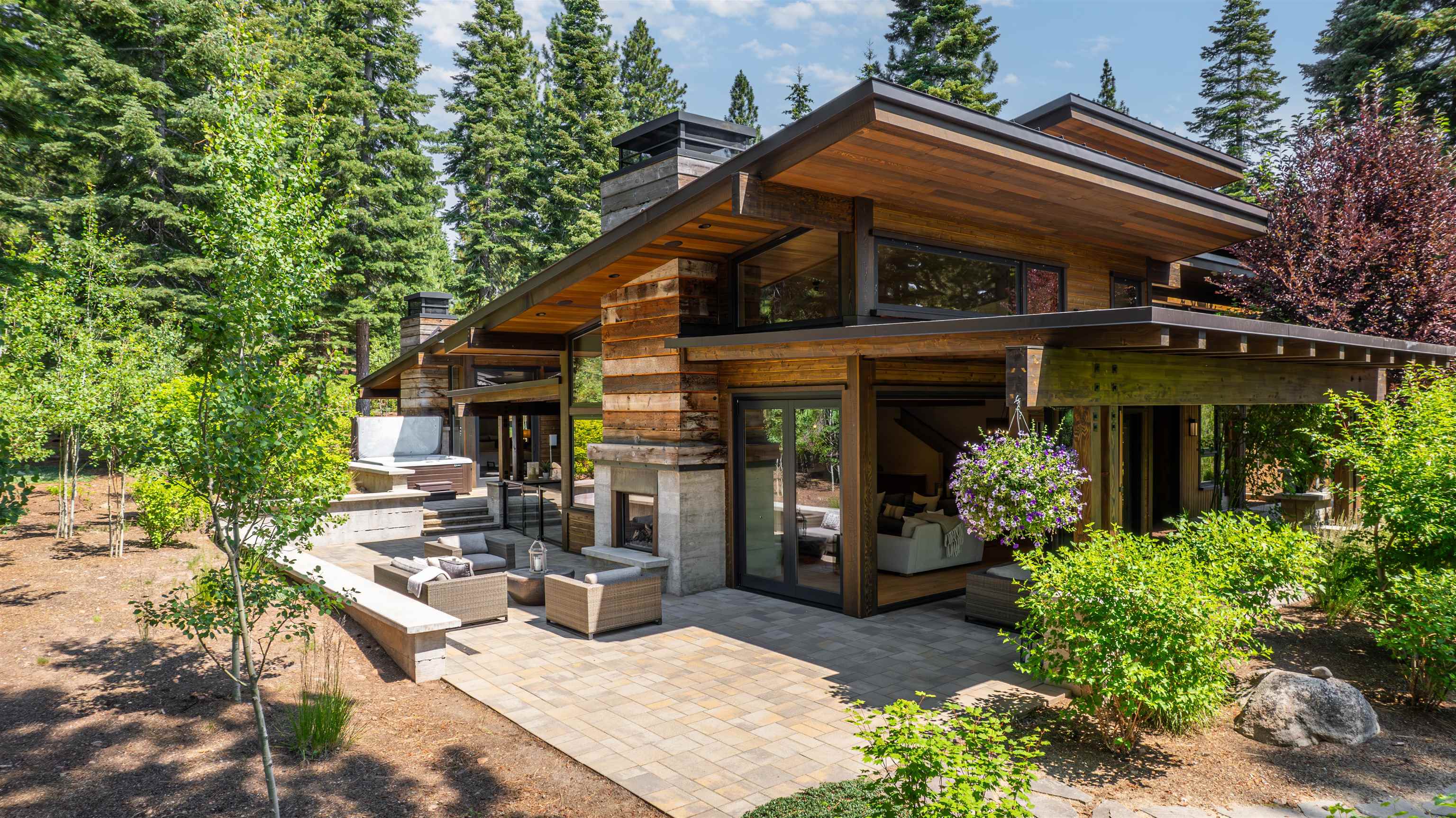 a view of a house with backyard and sitting area