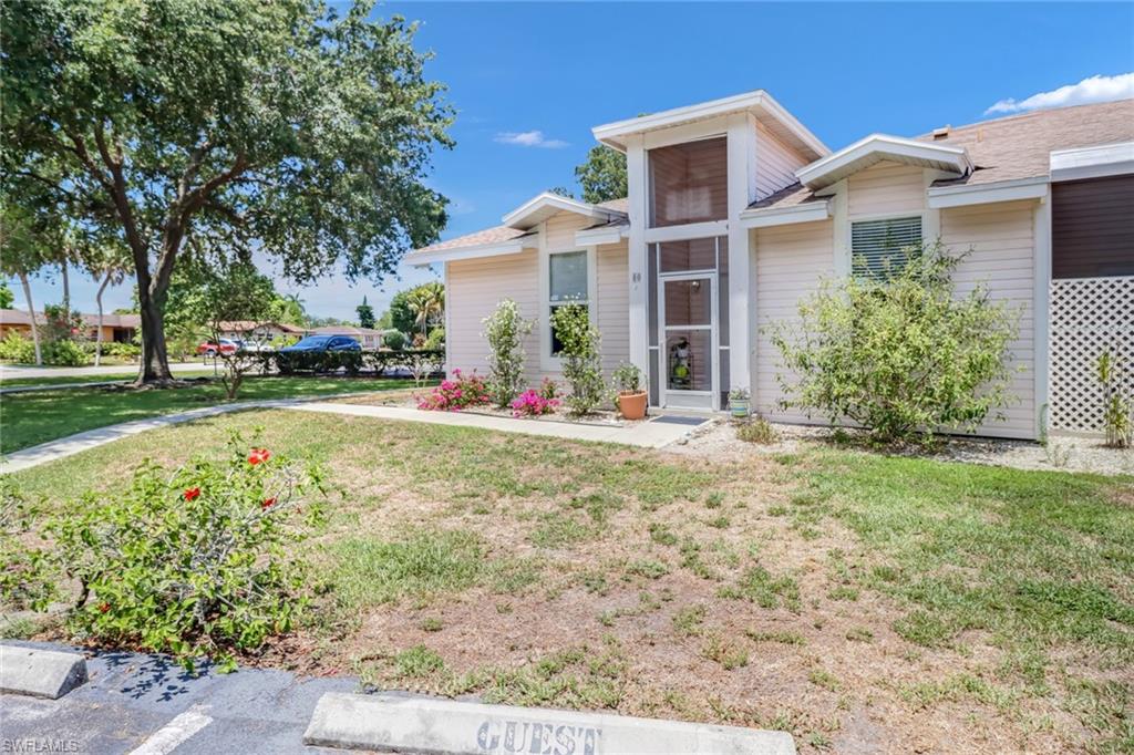 Single story home featuring a front yard