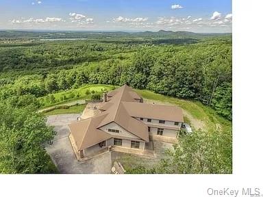 a aerial view of a house with a yard