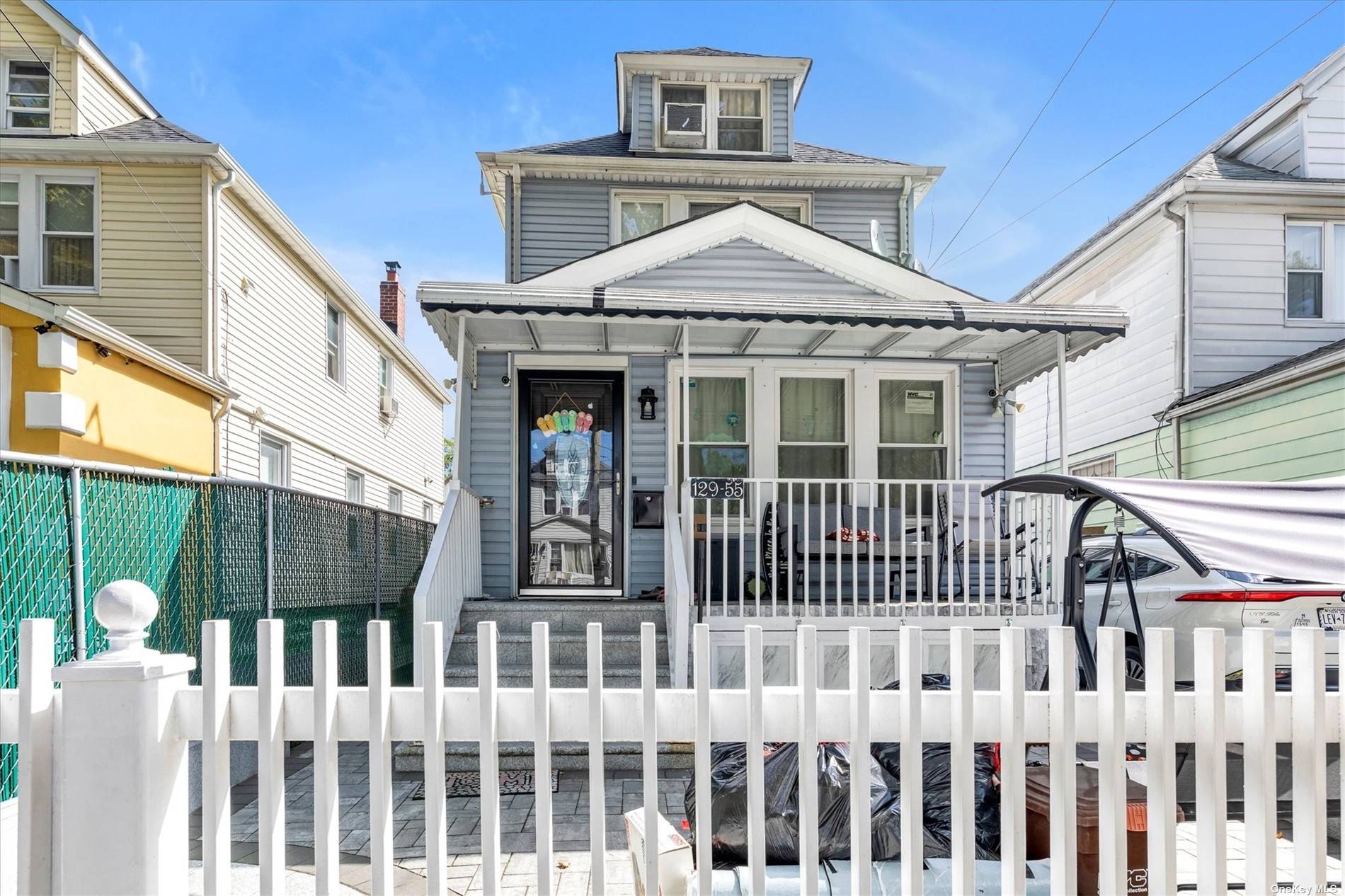 a front view of a house with a porch