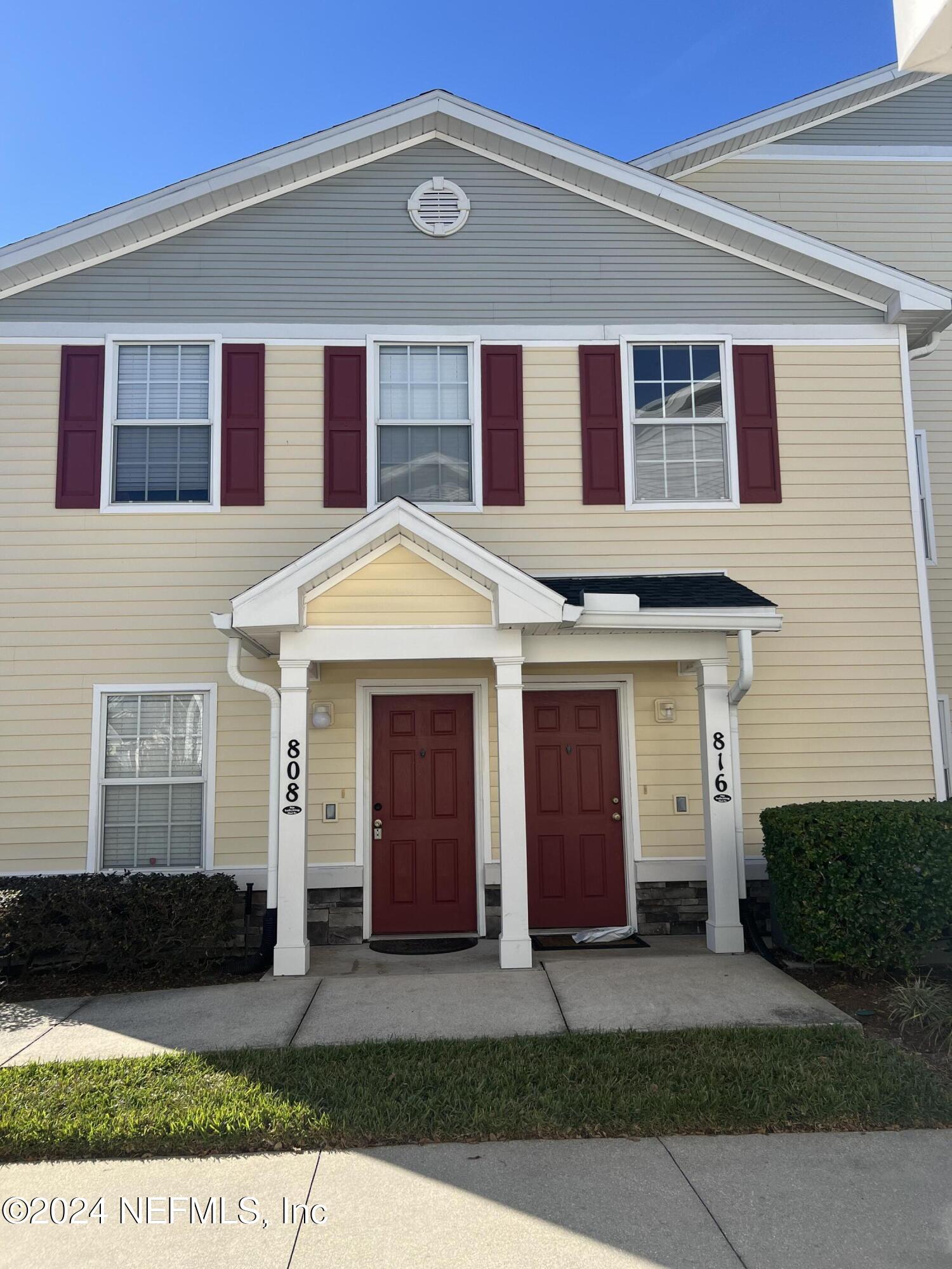 a front view of a house with yard