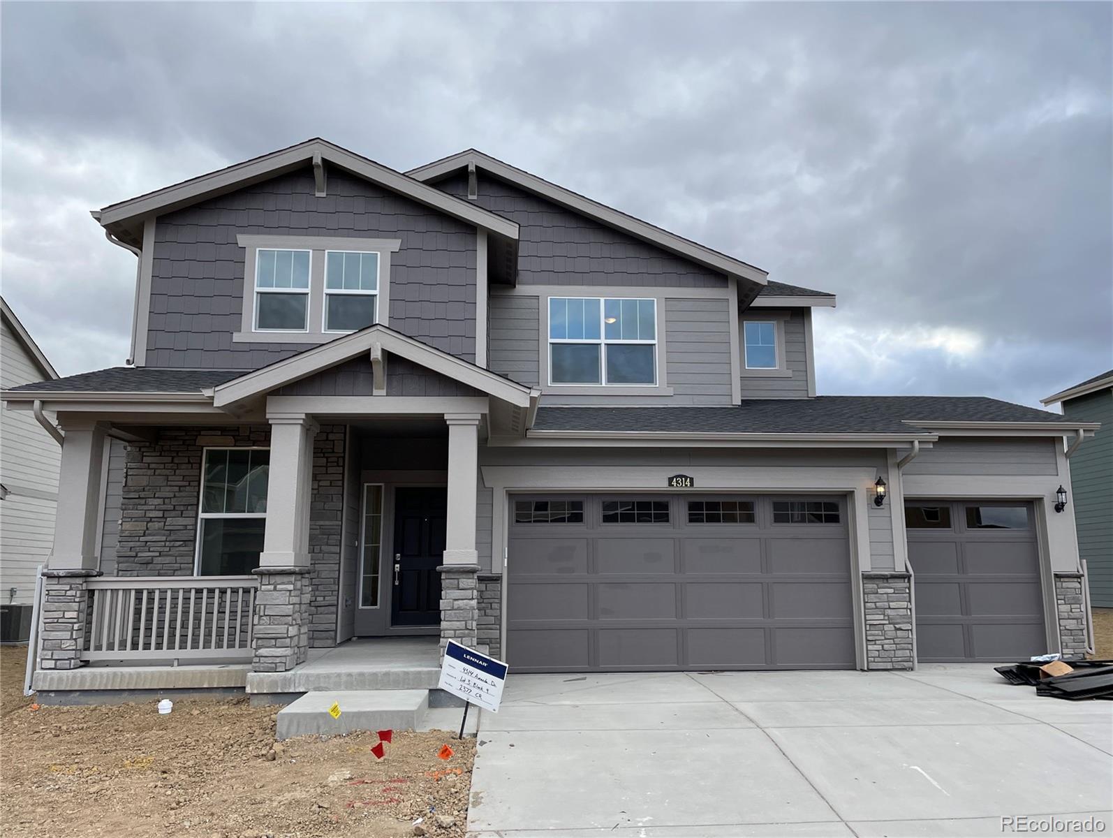 a front view of a house with a garage