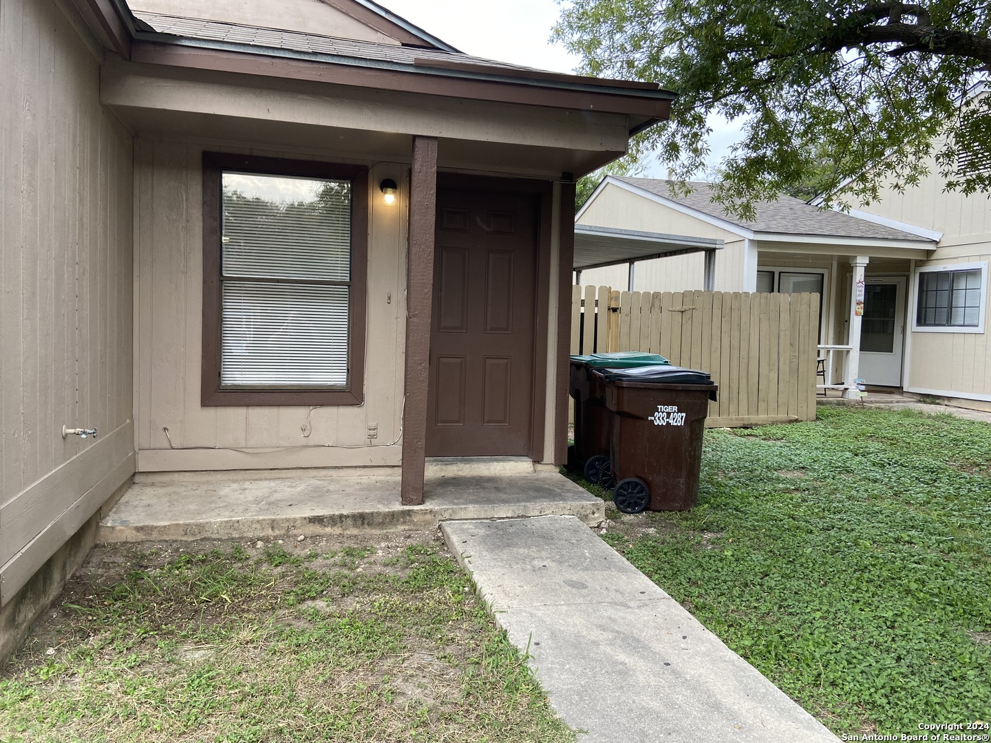 a view of house with backyard