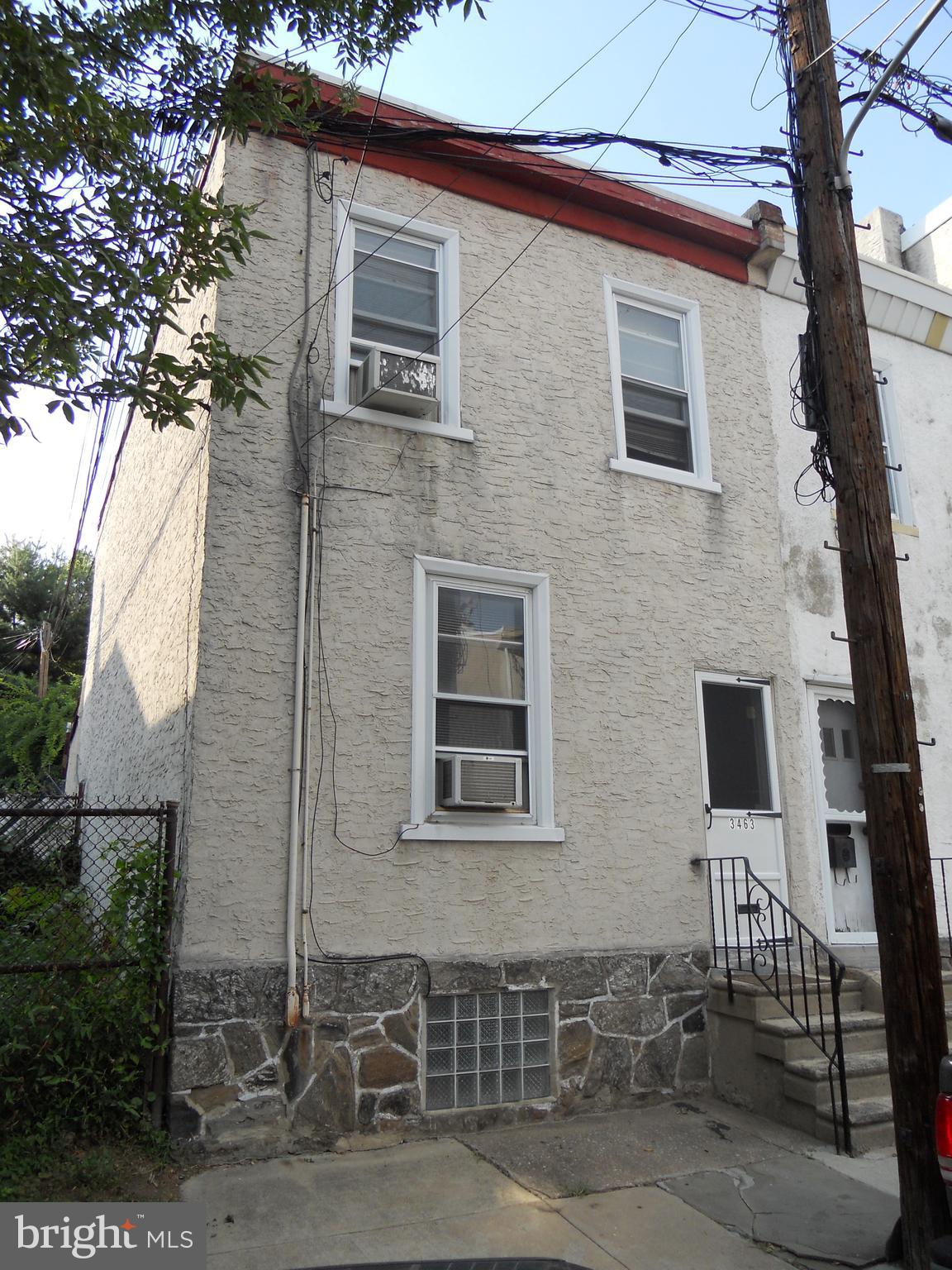 a front view of a house with parking space