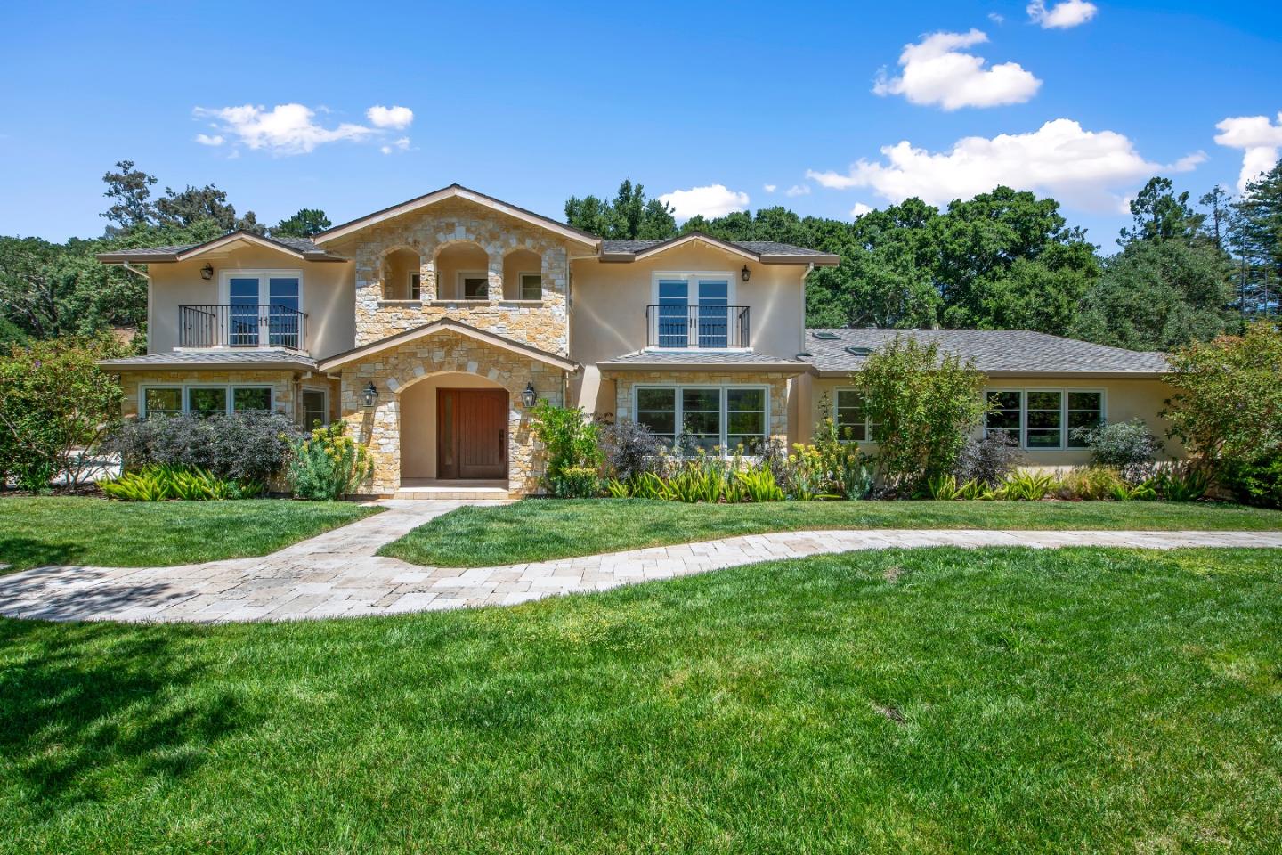 a front view of a house with a yard