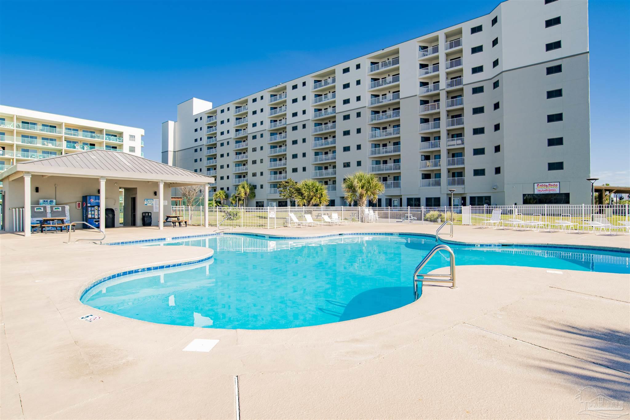 a view of swimming pool with outdoor seating