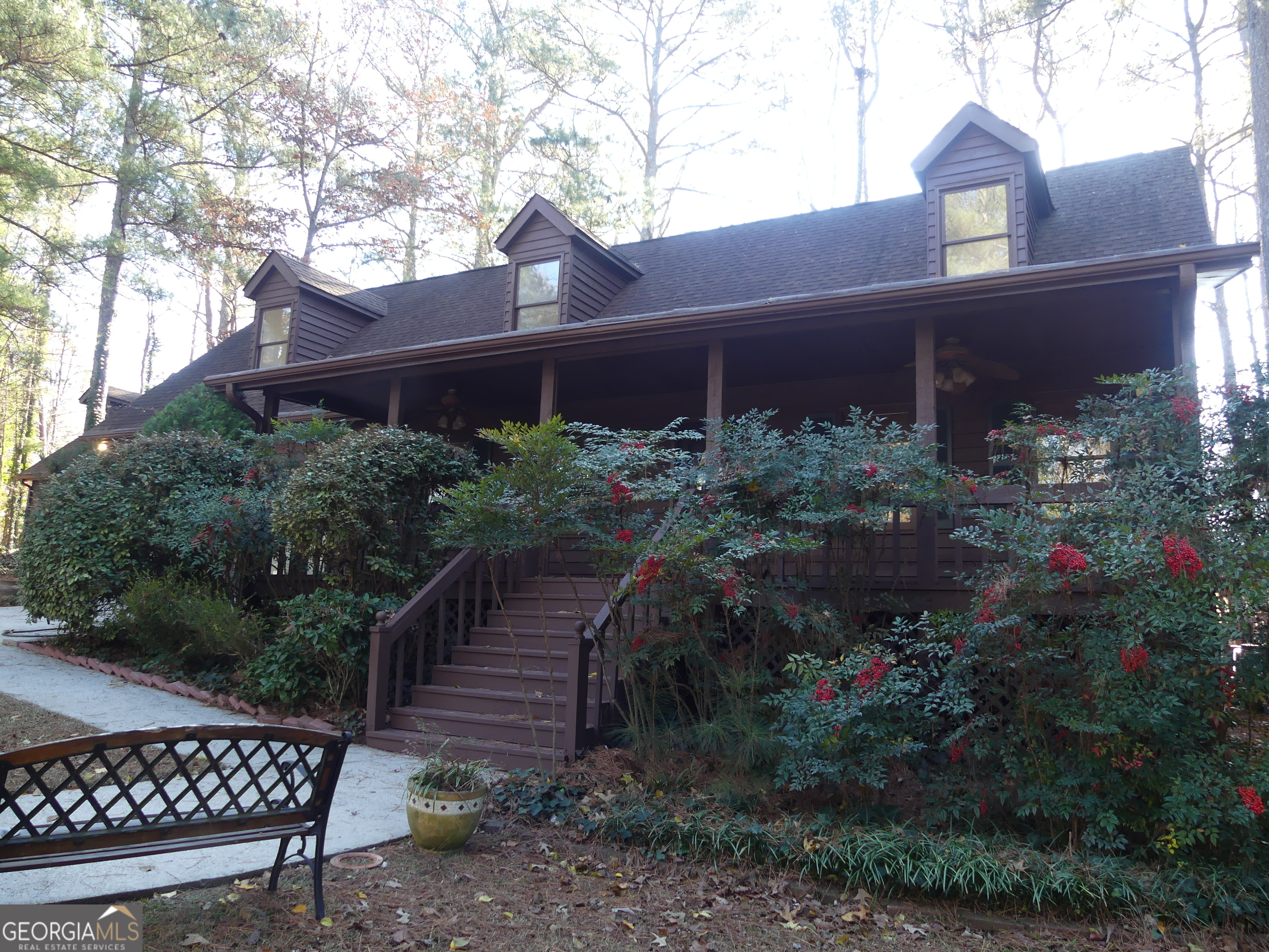 a front view of a house with garden