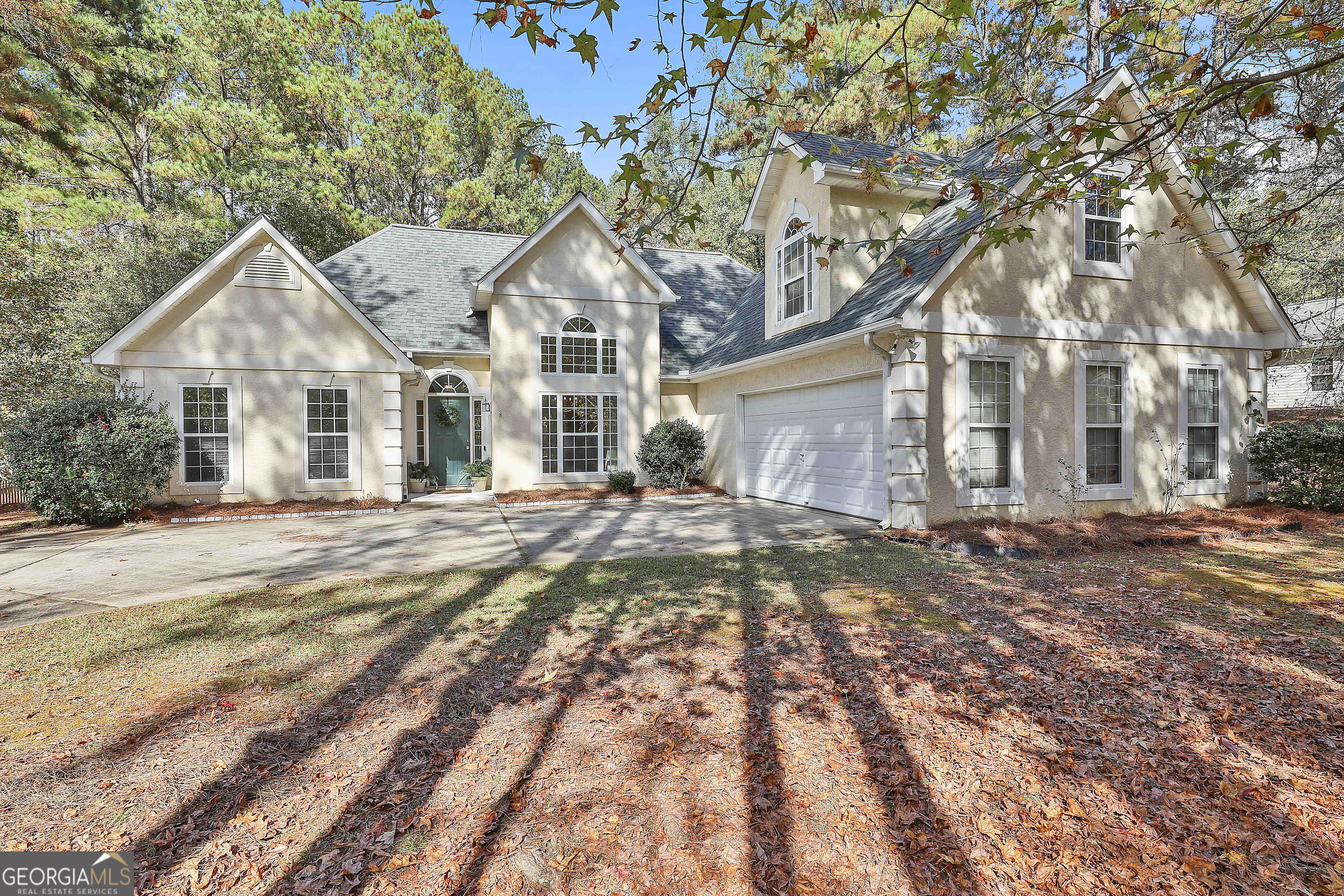 a front view of a house with a yard