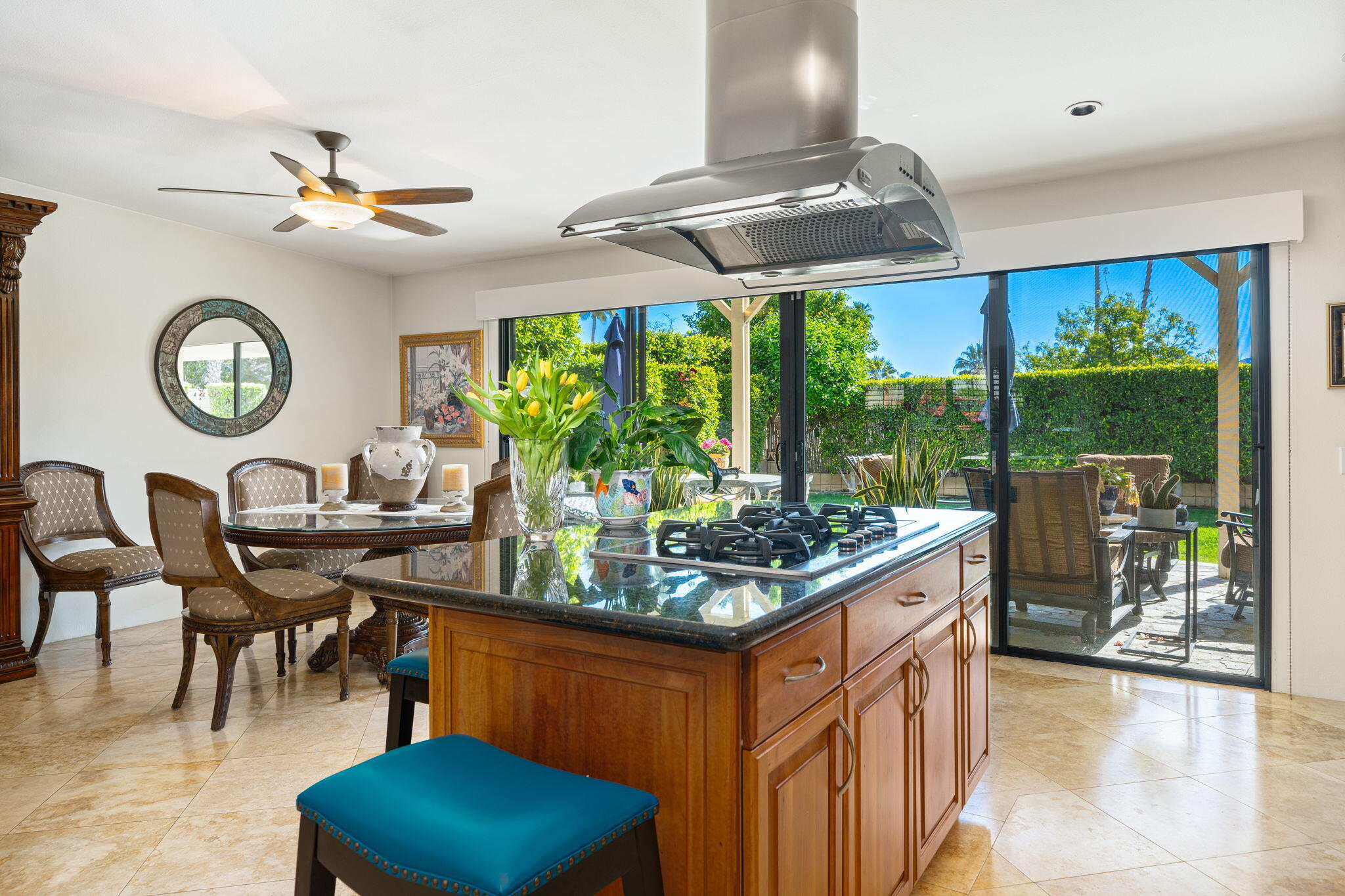 a kitchen area with furniture and a large window