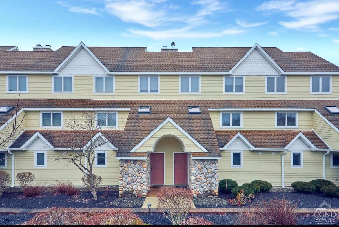 a front view of a house with yard