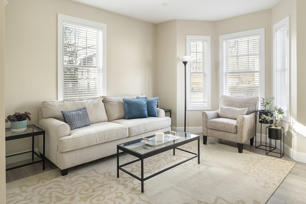 a living room with furniture and windows