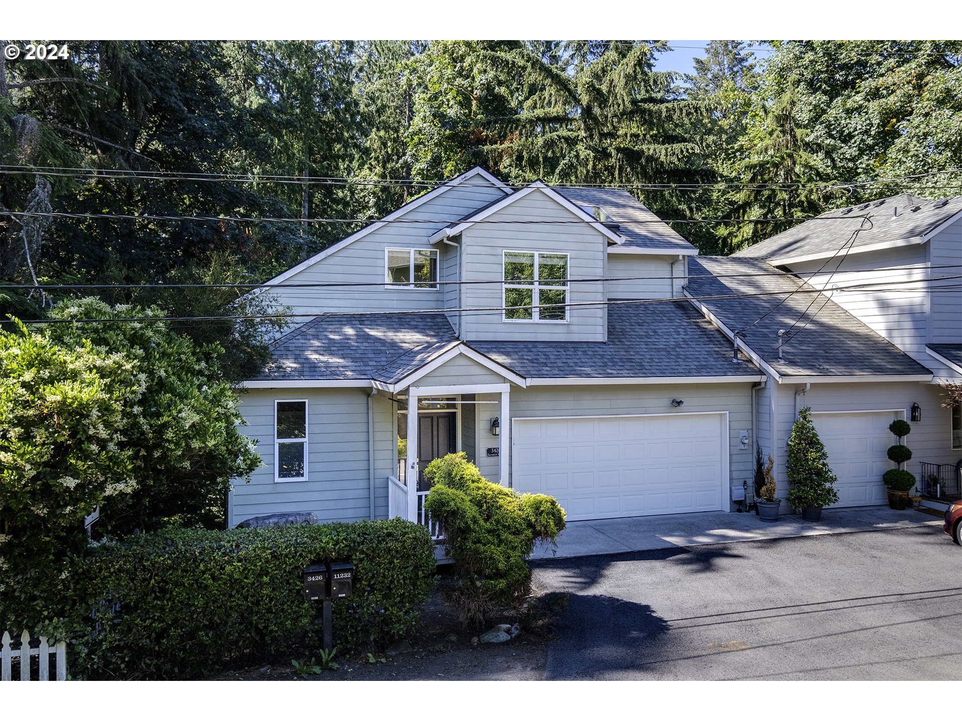 a front view of a house with yard