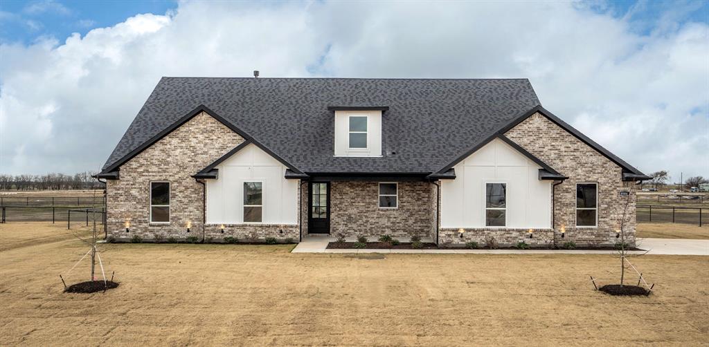 a front view of a house with yard