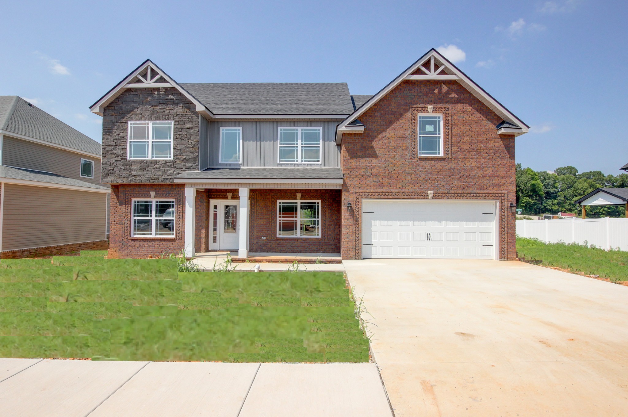 Home is complete. Sod is virtually altered in the photo and will be laid within the next 2 weeks.