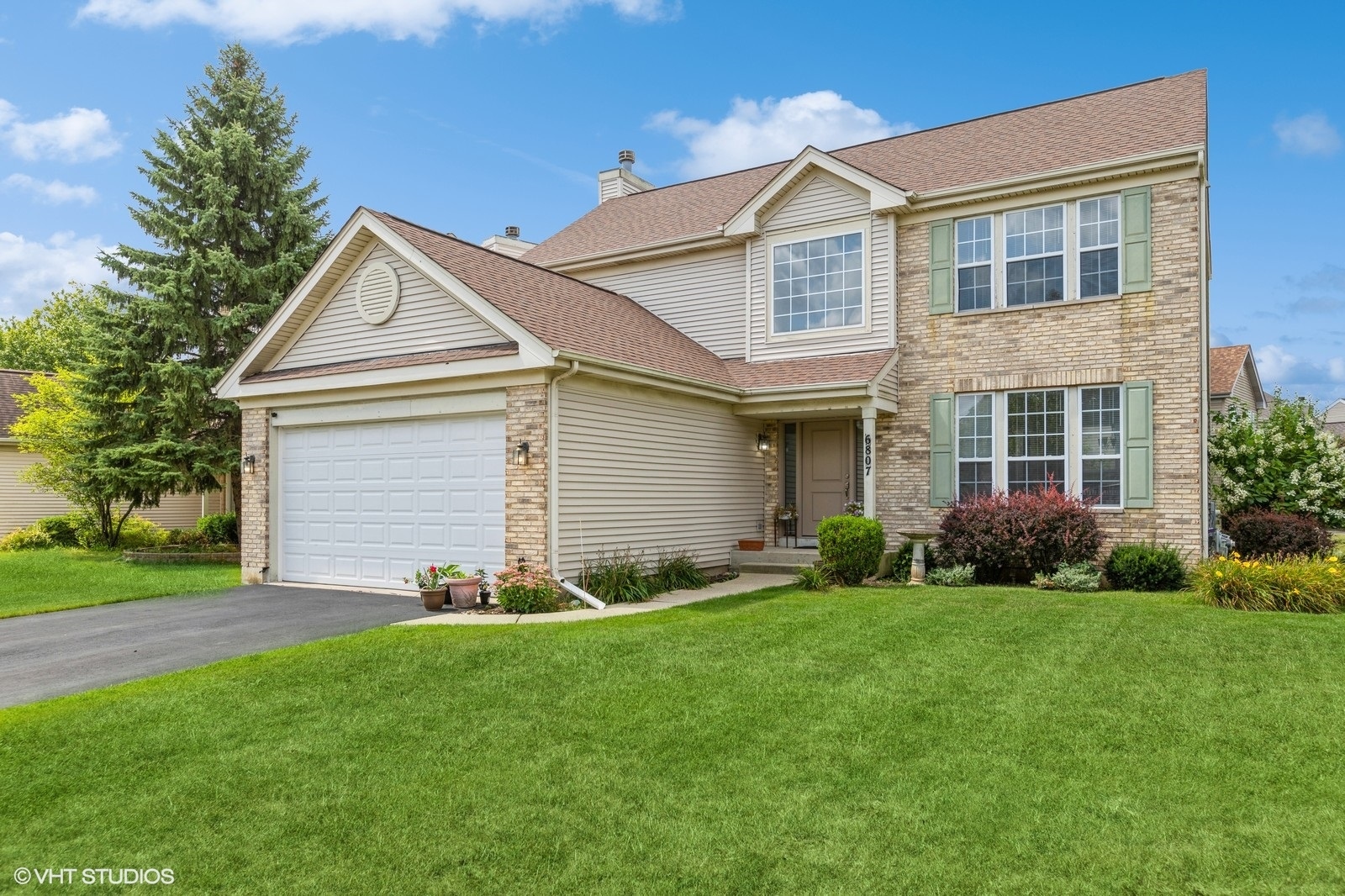 front view of a house and a yard