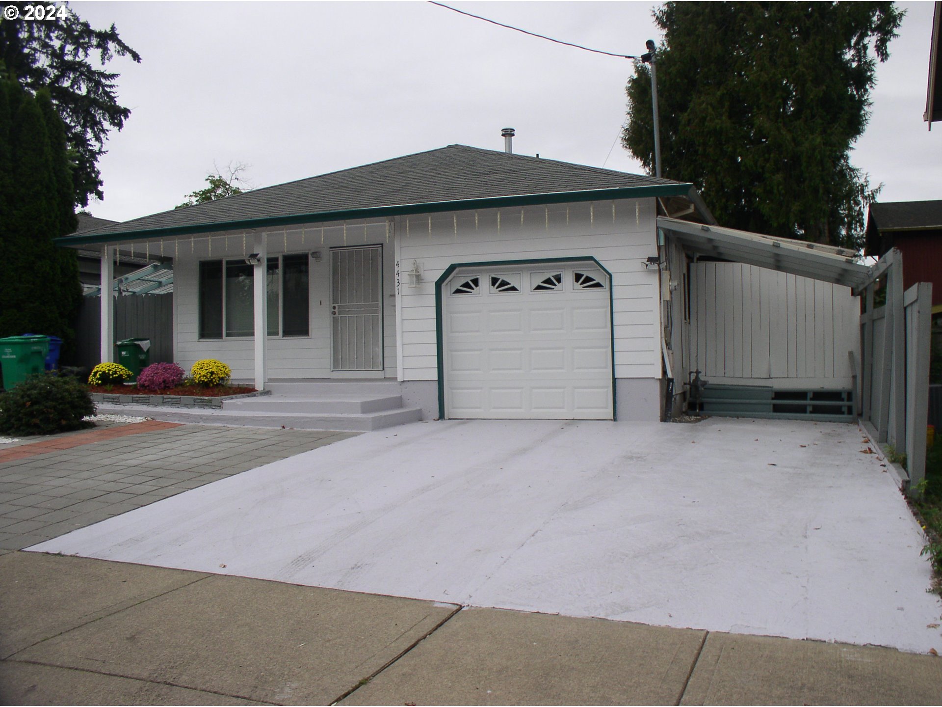 a front view of a house with garage