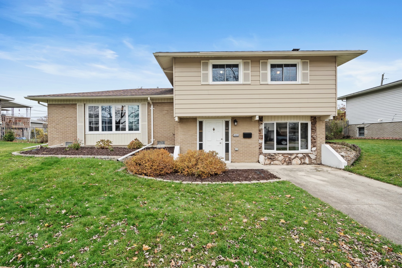 front view of a house with a yard