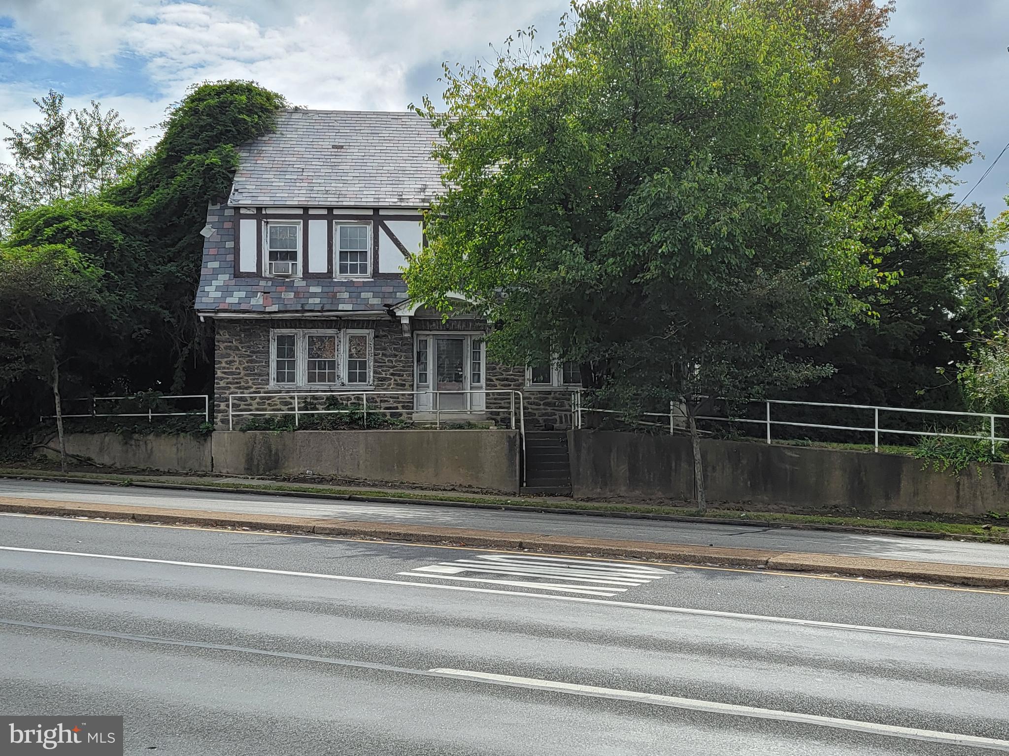 a view of a house with a iron gate