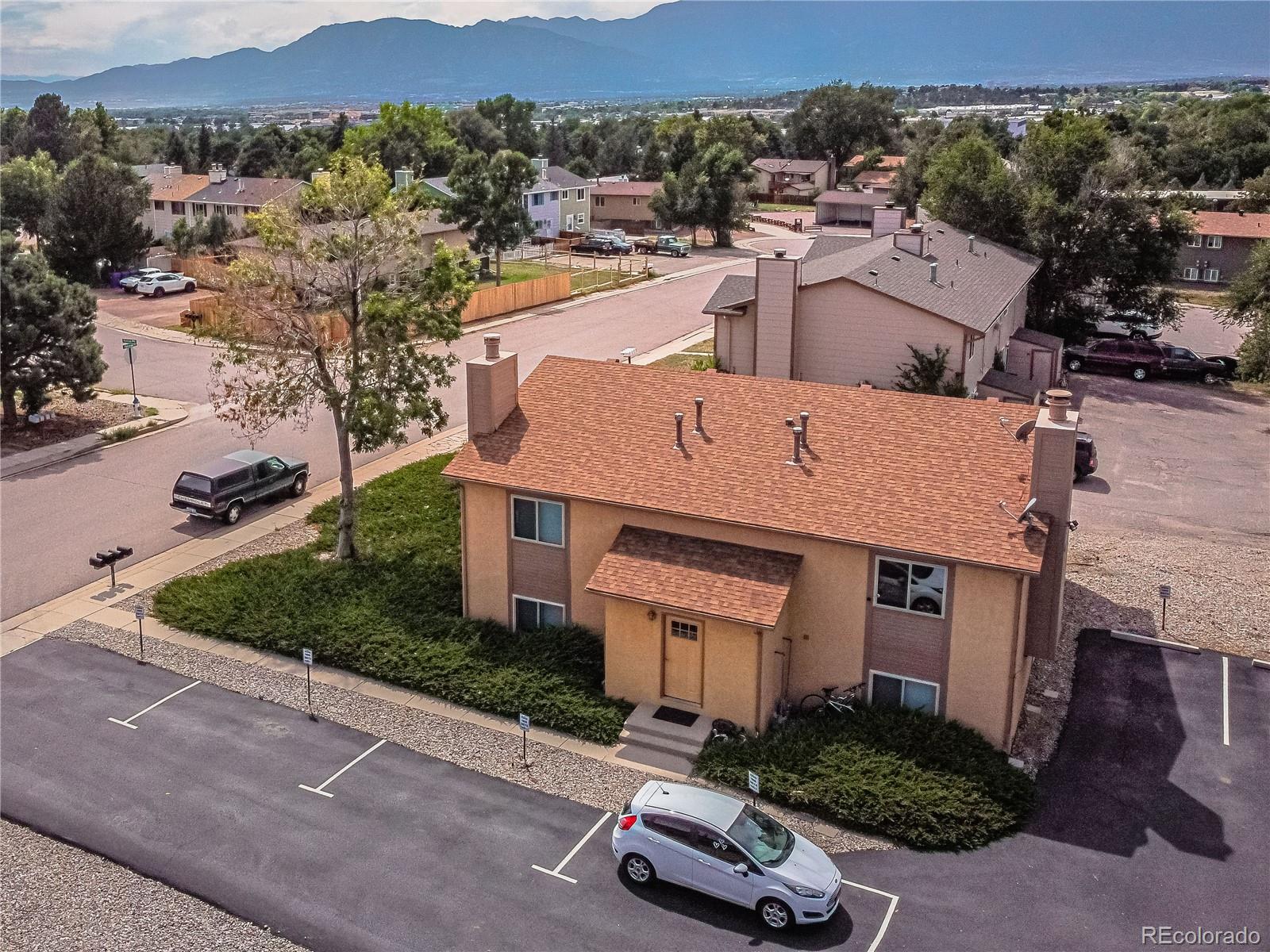 an aerial view of a house with yard table and chairs