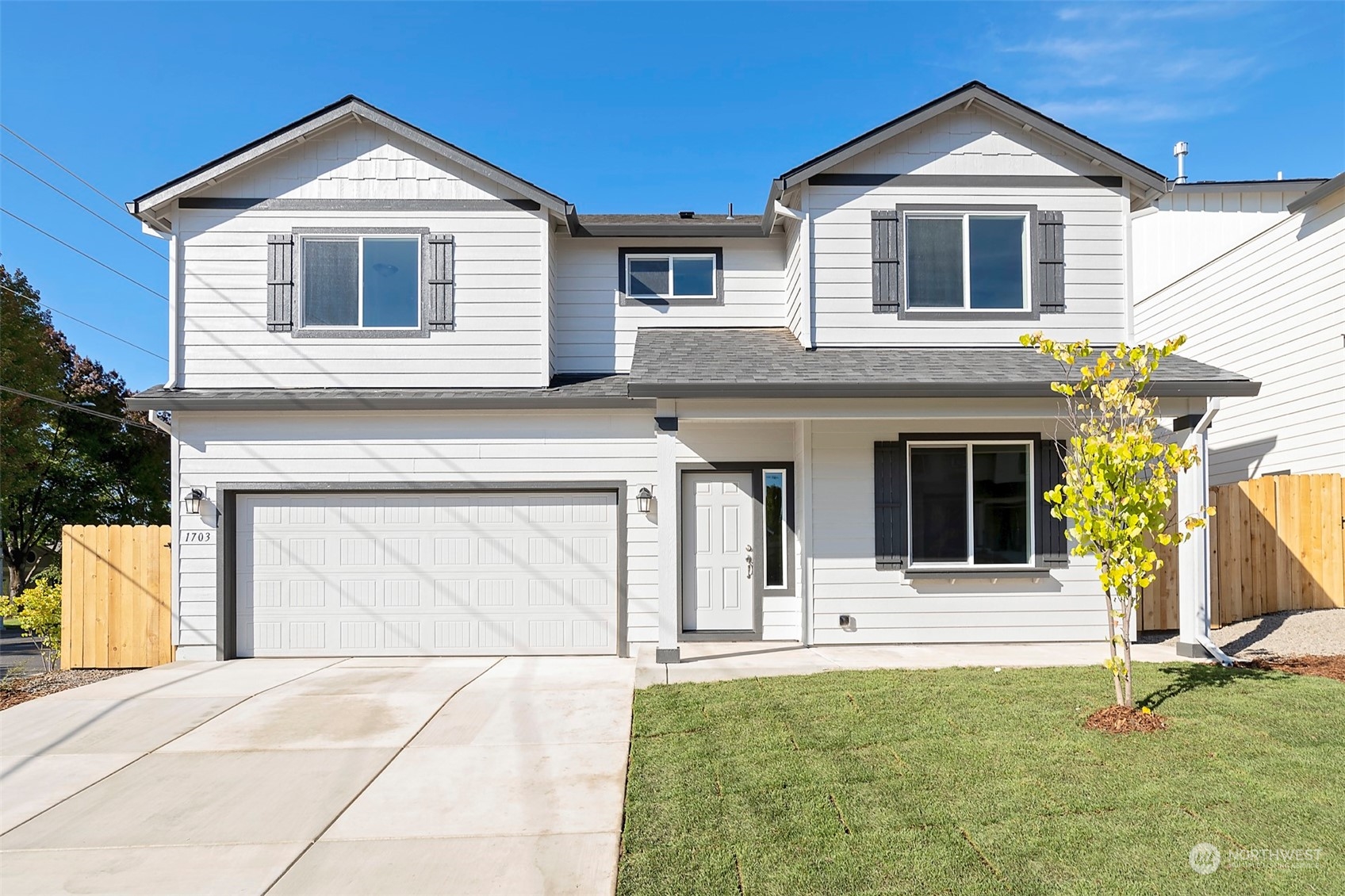 a front view of a house with garage