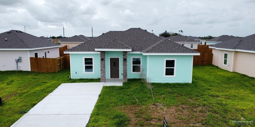 front view of a house with a yard