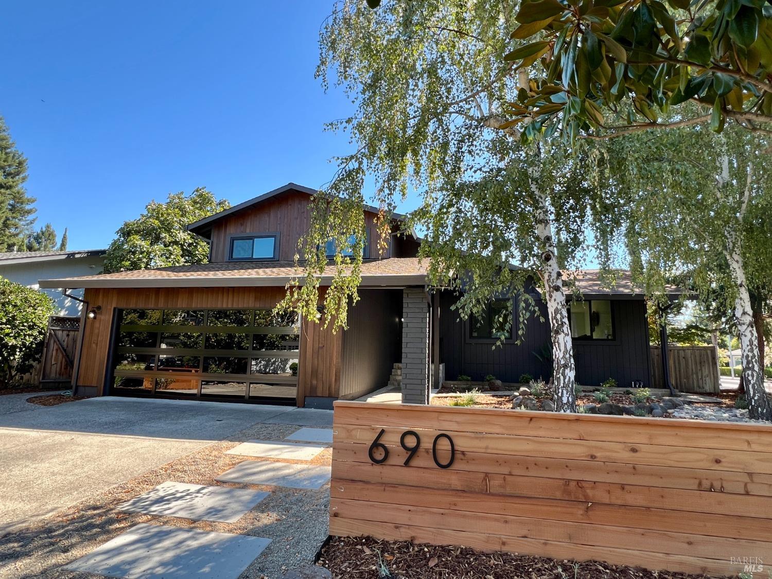 a view of house with outdoor space and sitting area