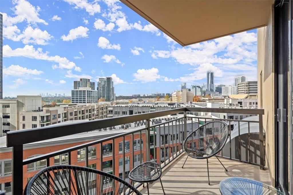 a view of a balcony with wooden benches