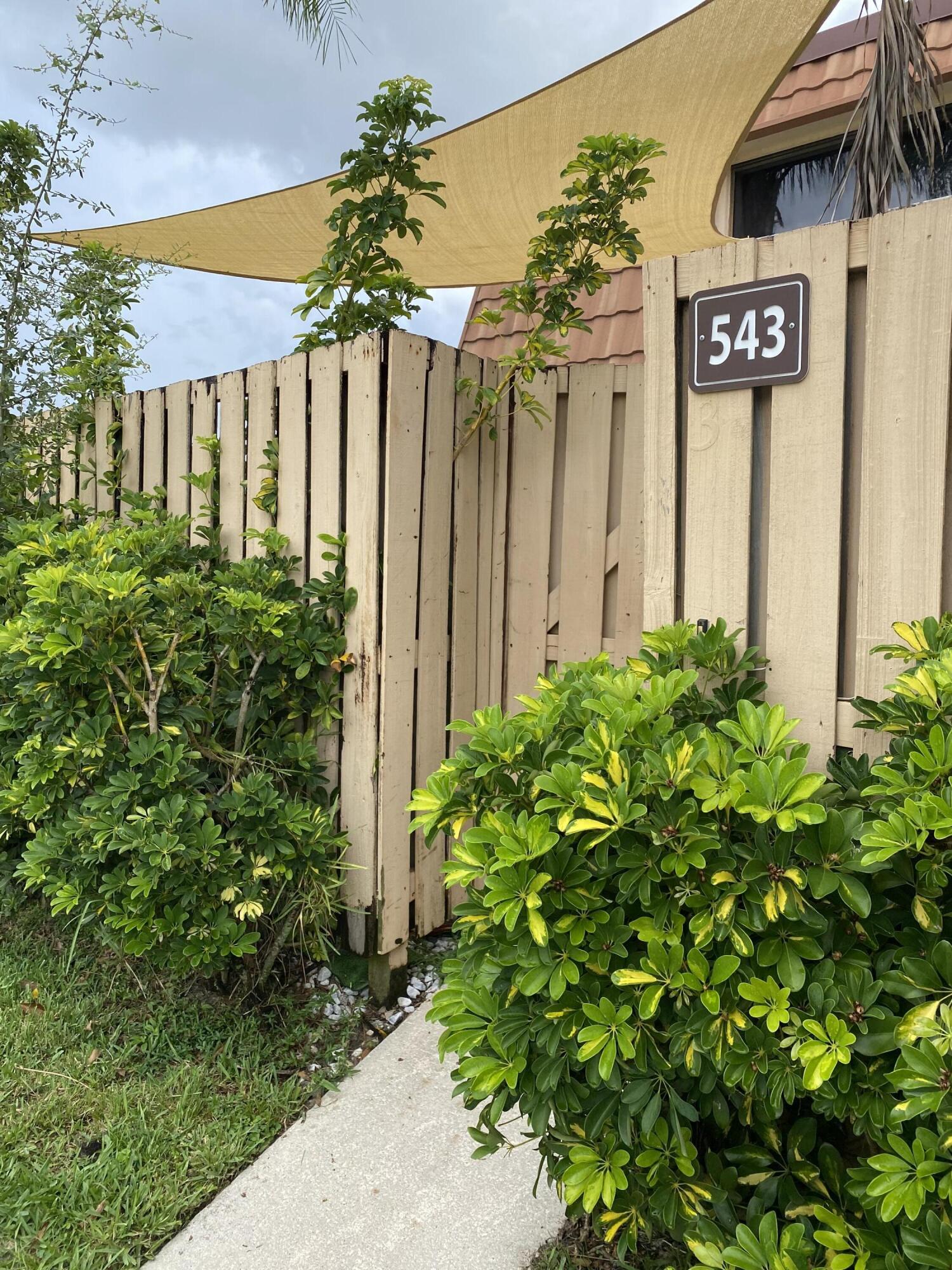 a view of a house with a flower plants