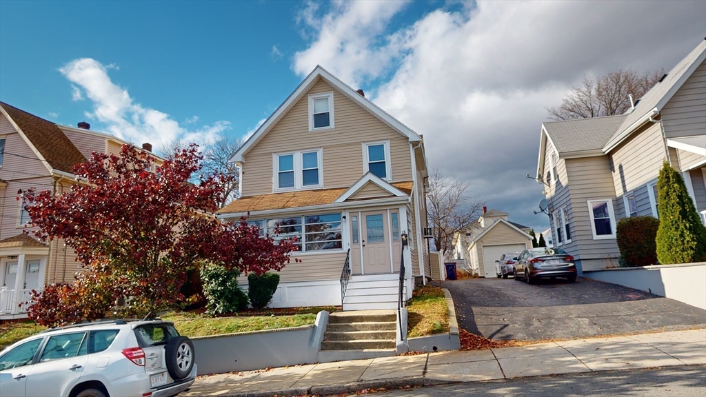 a front view of a house with a yard