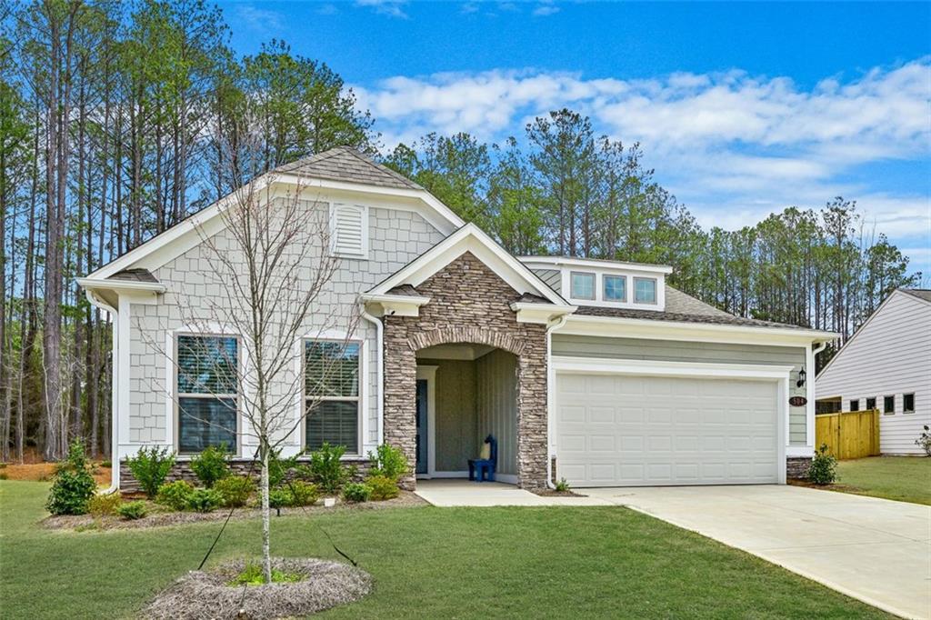 a view of house with yard and entertaining space