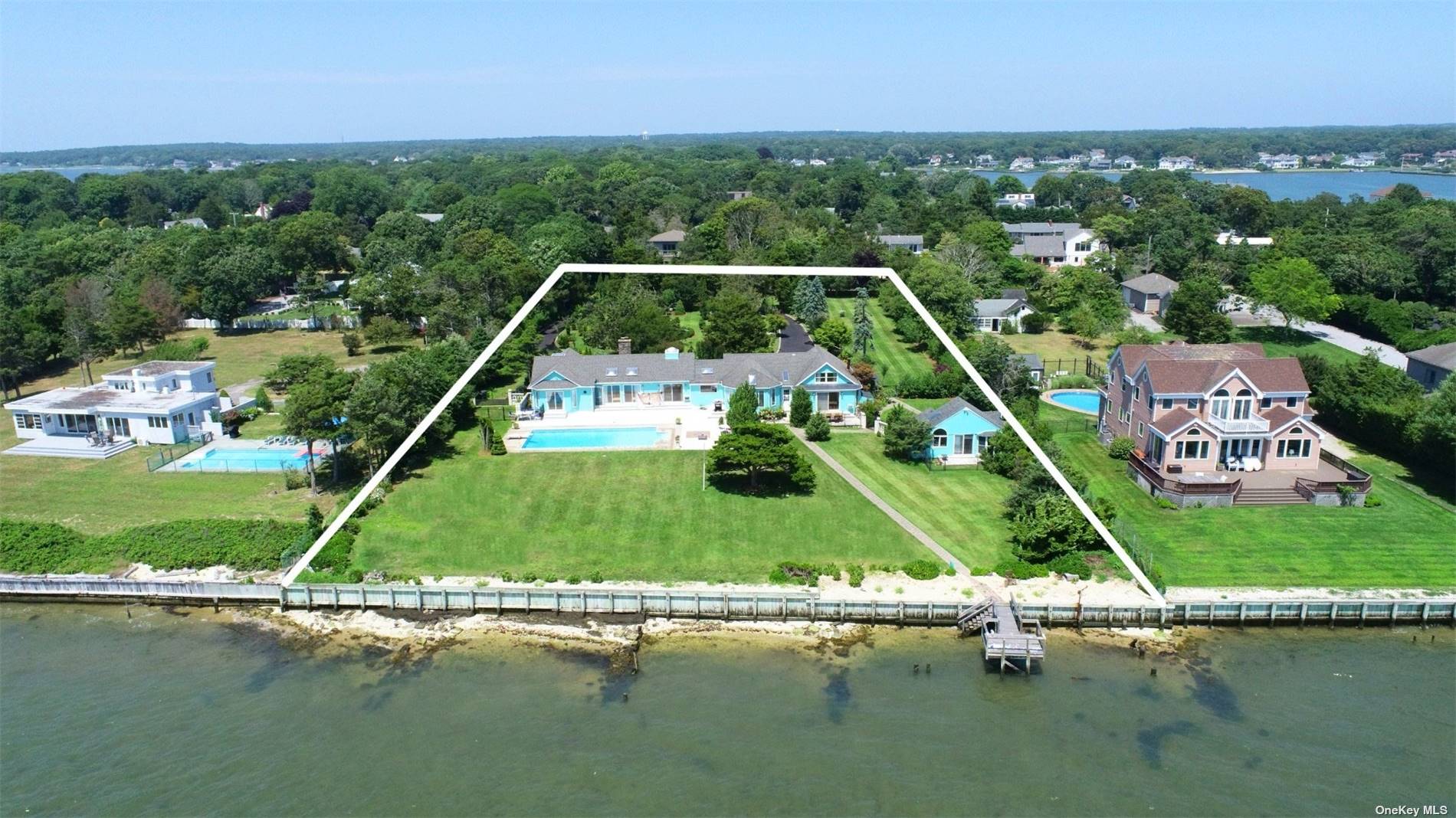 aerial view of a house with a lake view