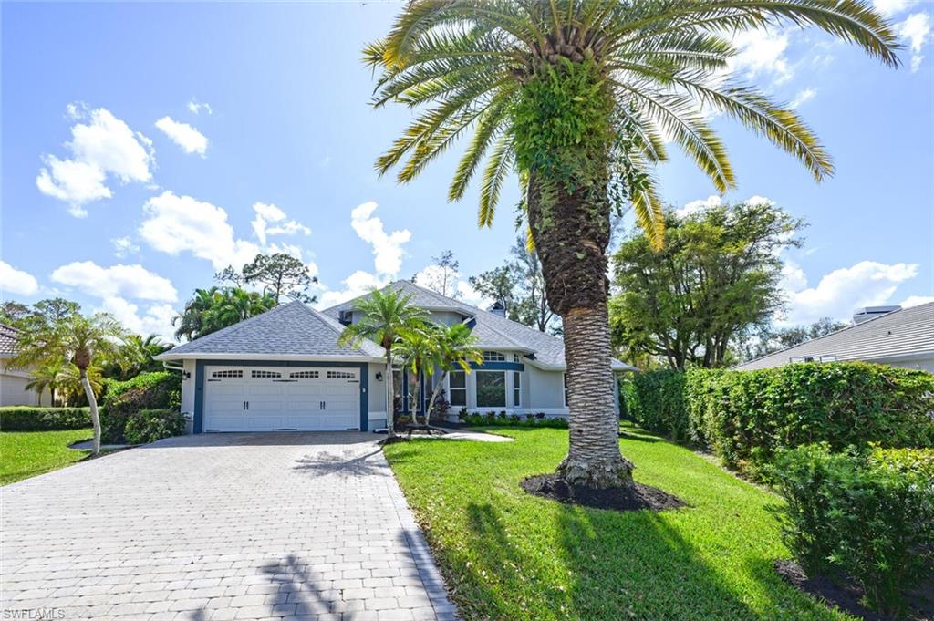 View of front of home with Gorgeous 40 Foot Mature Canary Island Date Palm Tree