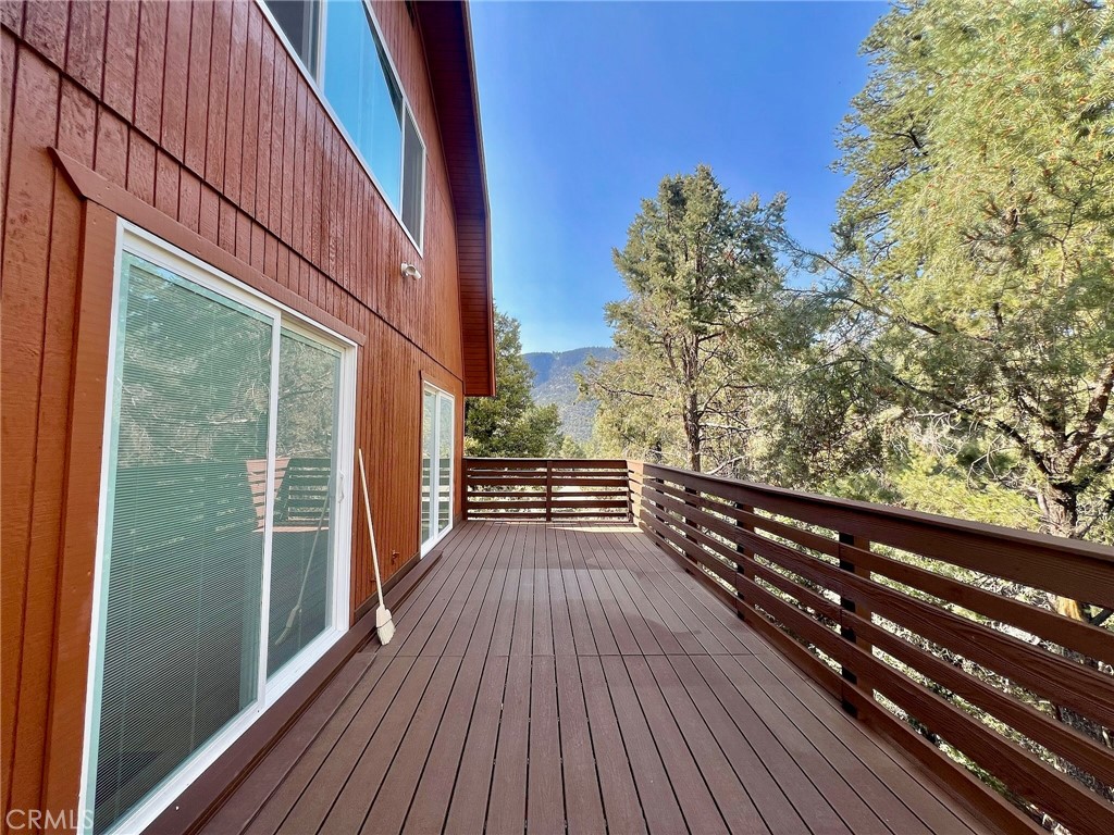 a view of balcony with wooden floor