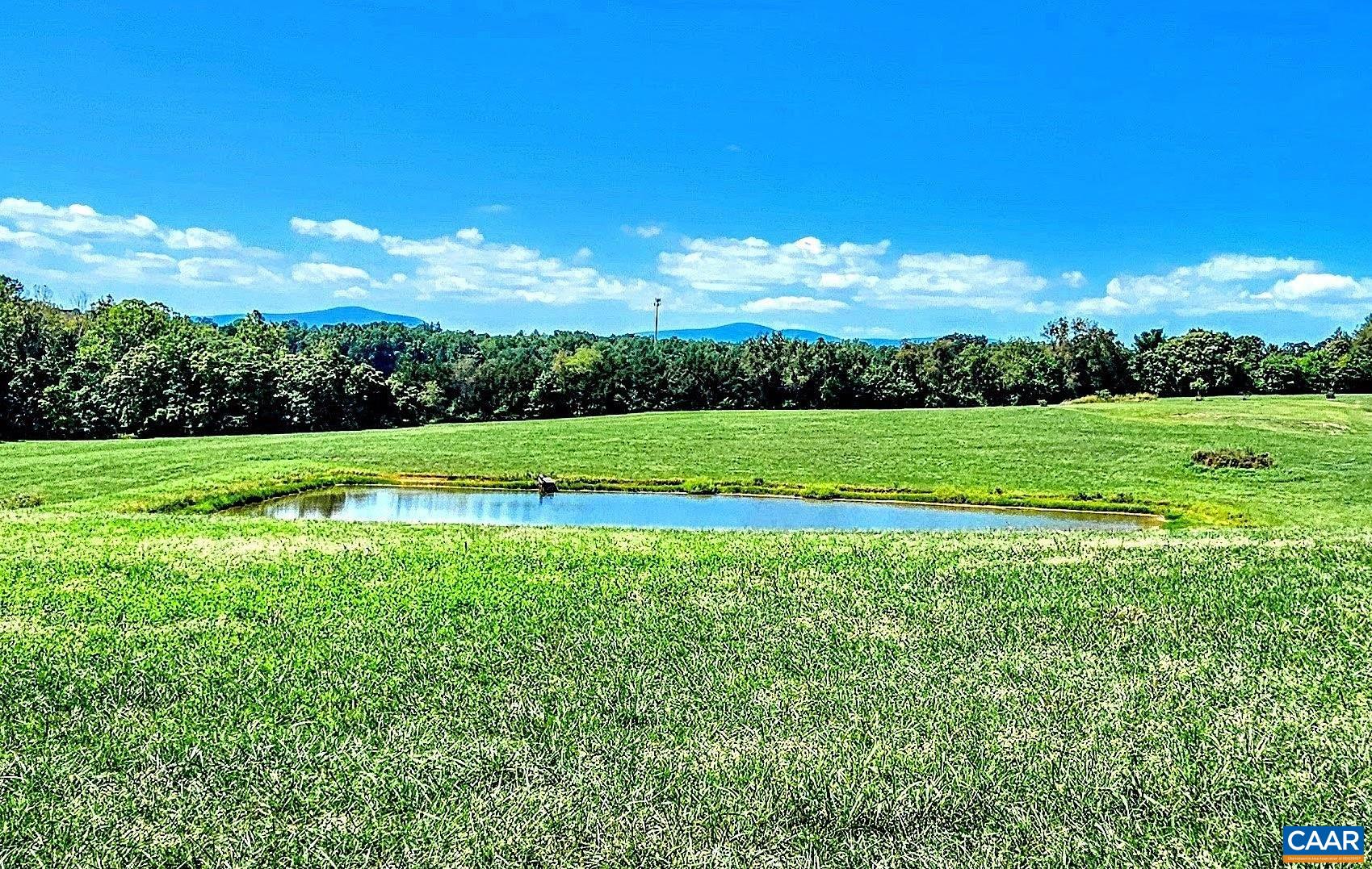 a view of a golf course with a big yard