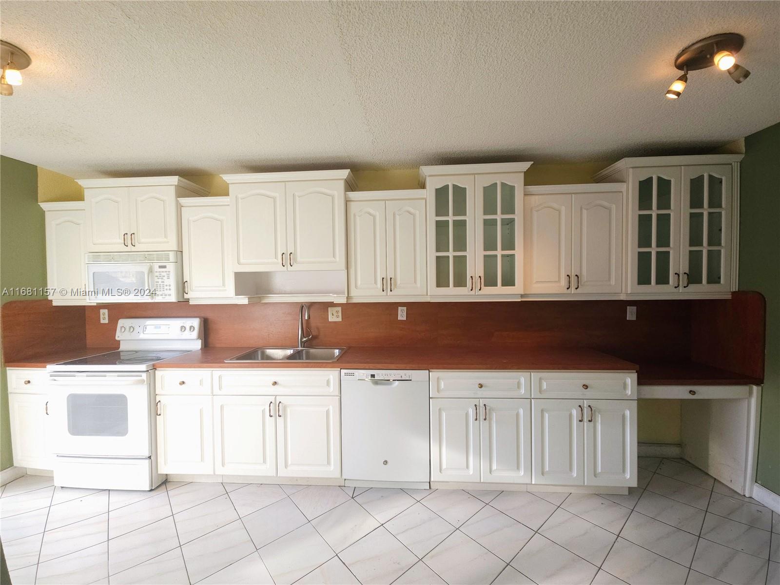 a kitchen with a cabinets and window