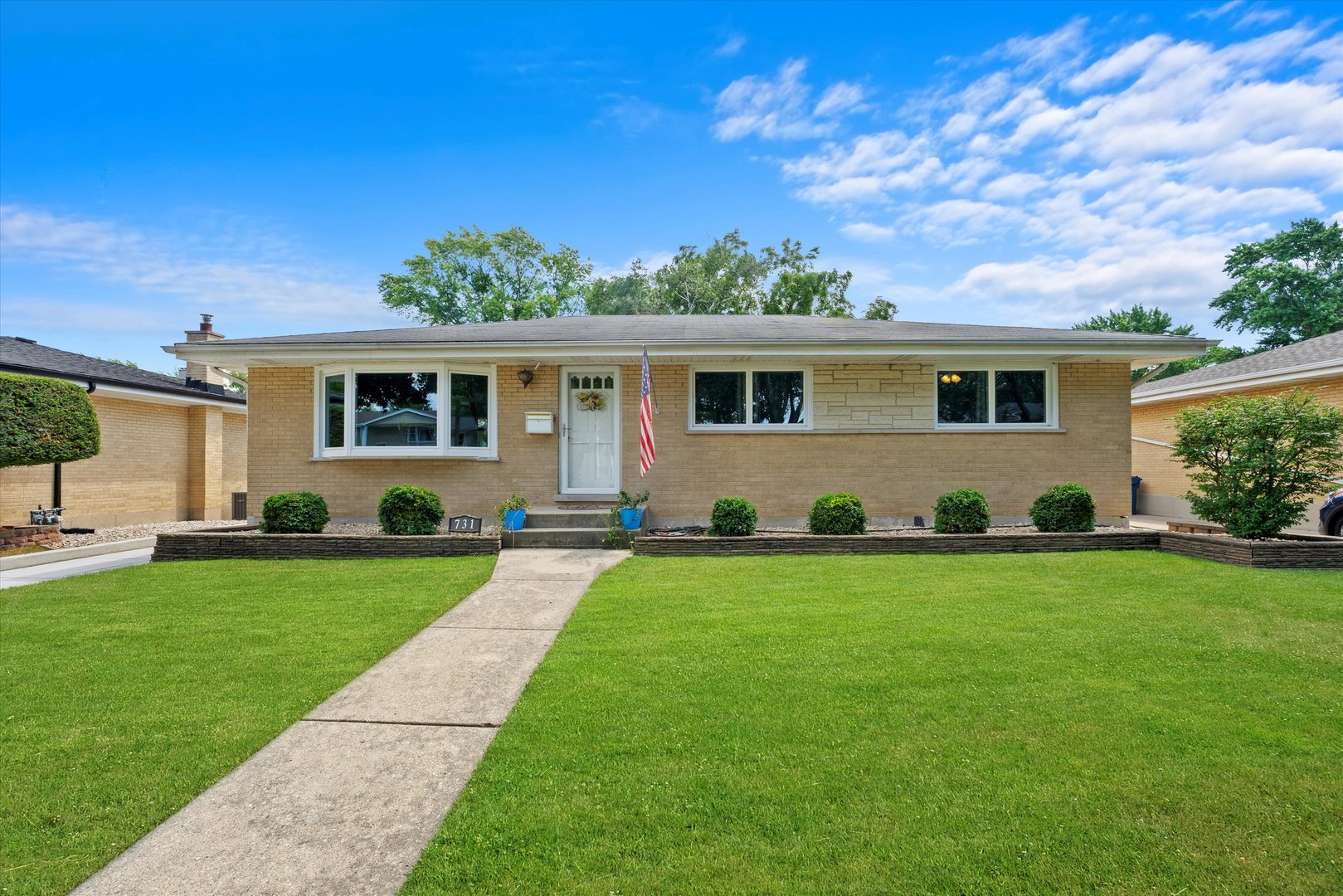 front view of a house with a yard