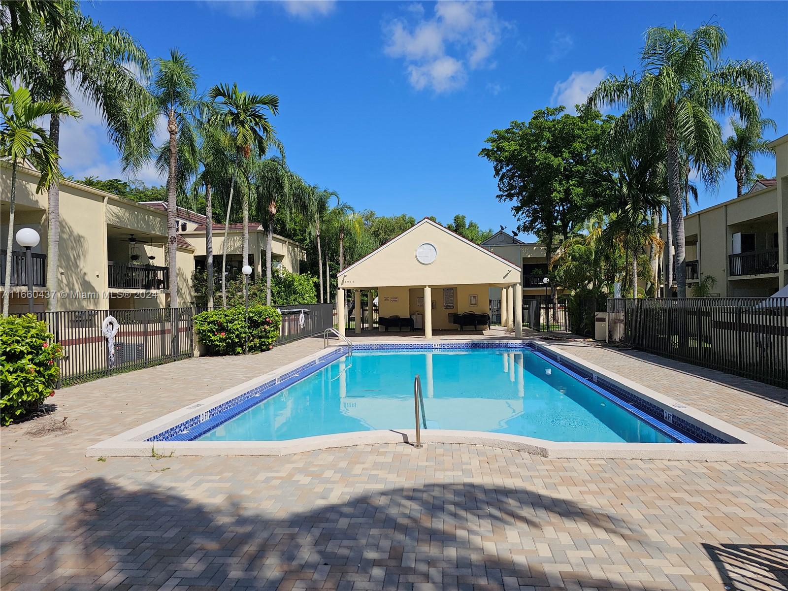 a view of a house with swimming pool