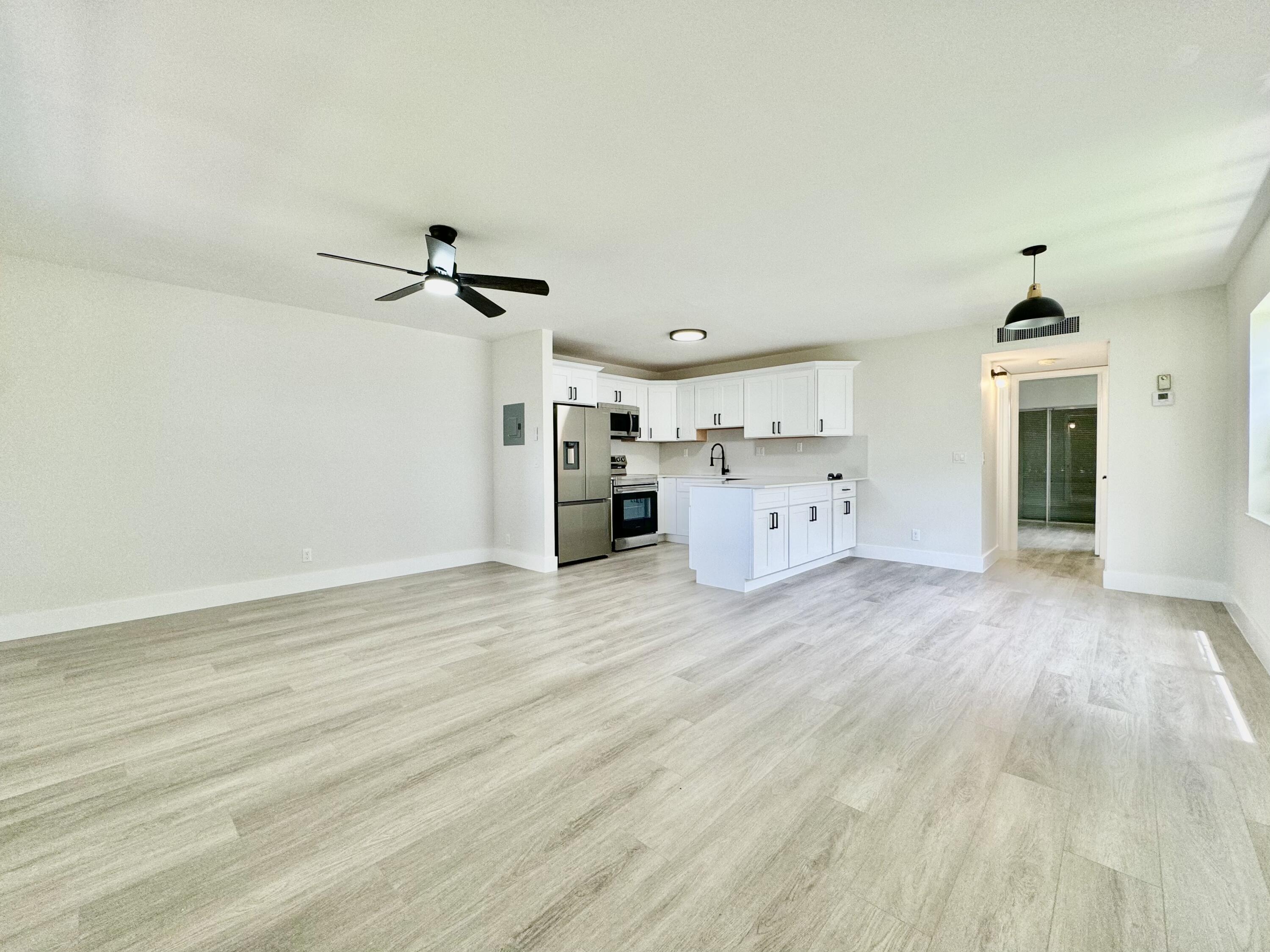 a view of a kitchen with a wooden floor