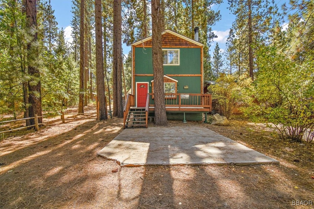 a view of outdoor space with deck and tree