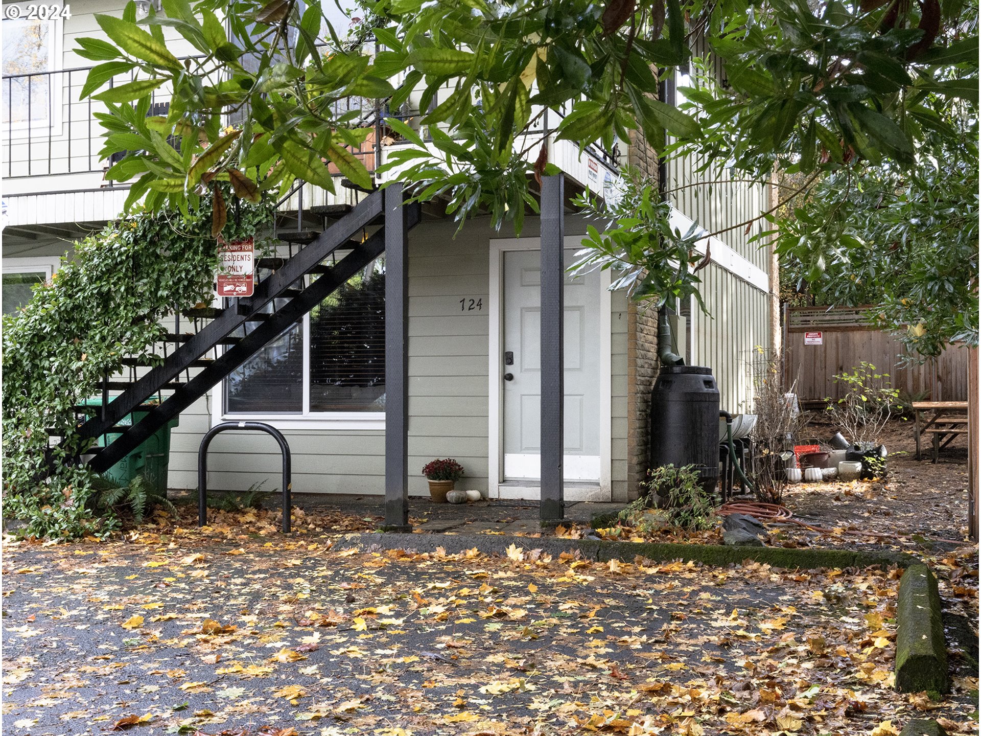 a backyard of a house with table and chairs