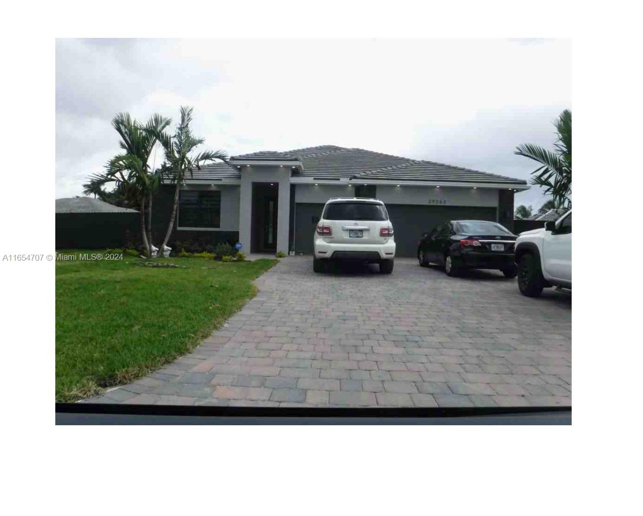 a car parked in front of a house