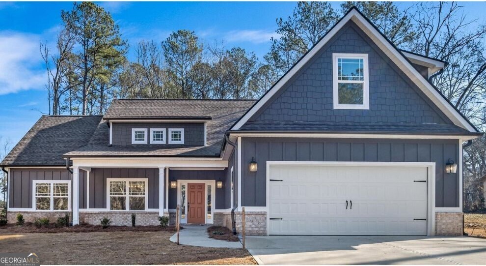 a front view of a house with a garage