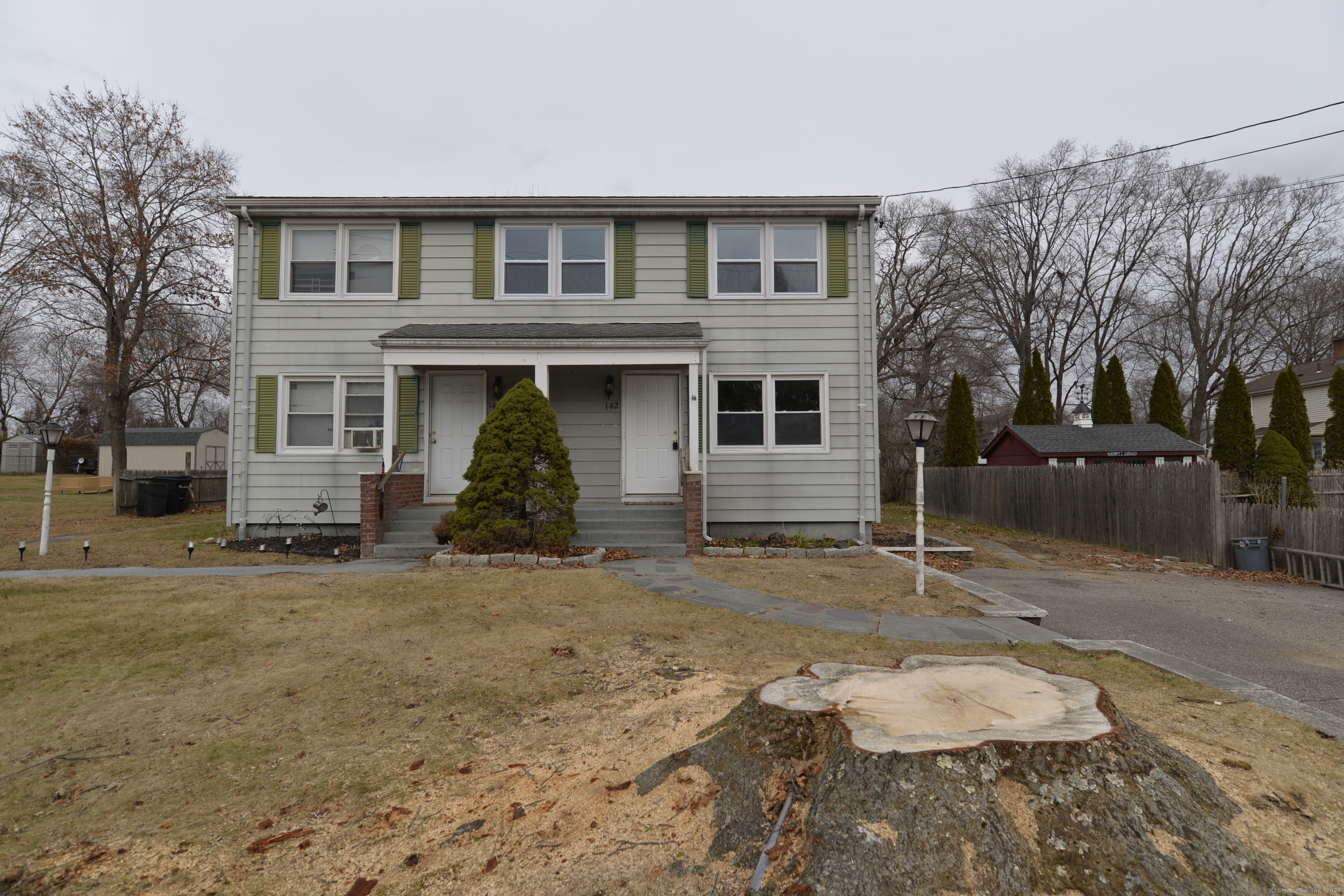 a front view of a house with a yard