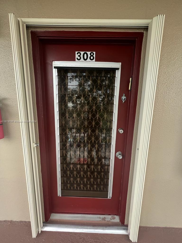 a view of a wooden door with a red door