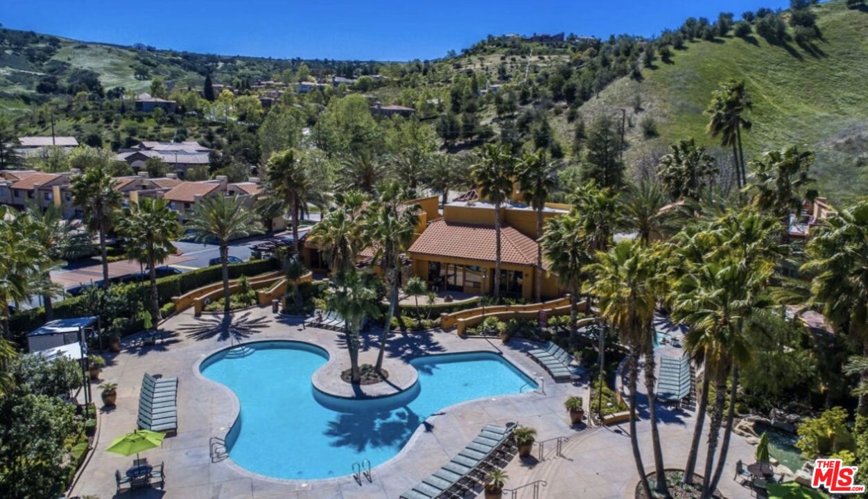 an aerial view of a house with outdoor space