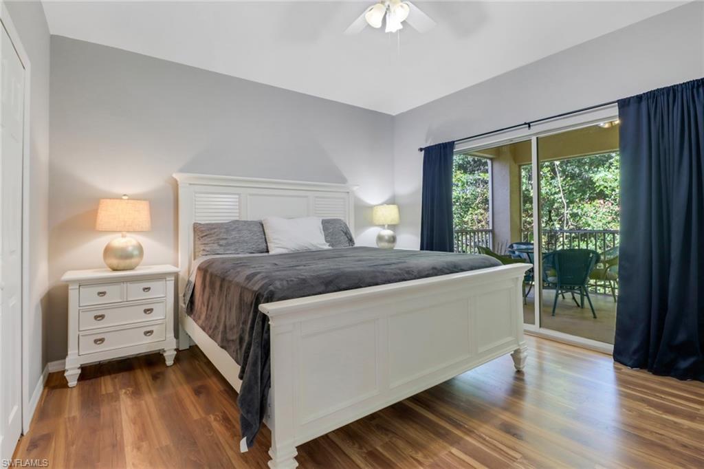 a bedroom with a bed and a dresser next to a window