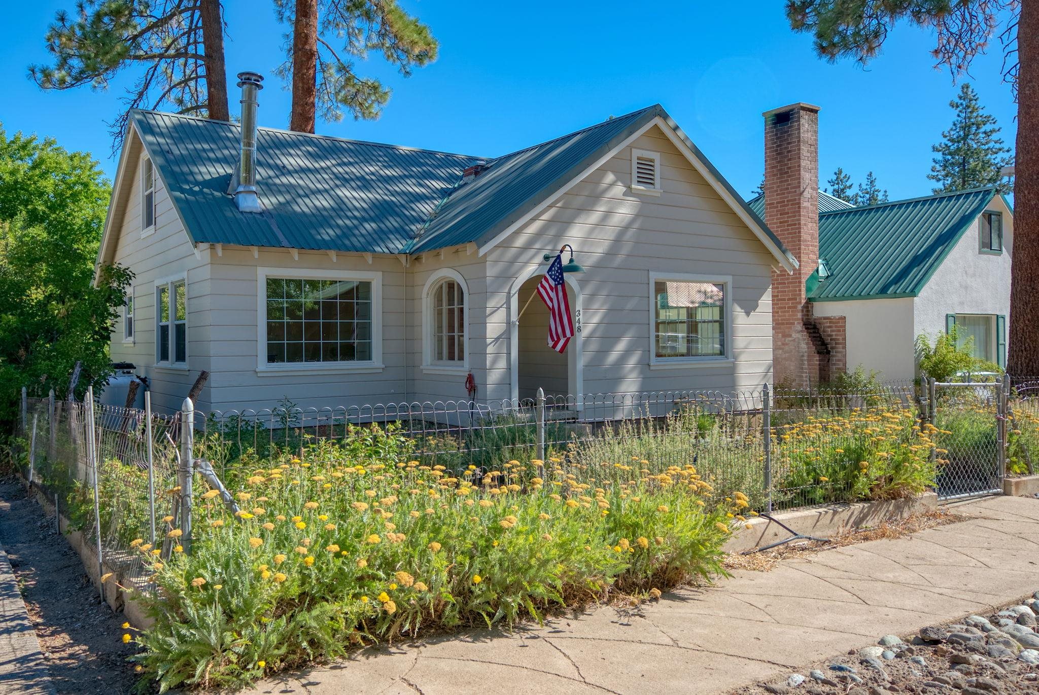 a front view of a house with garden