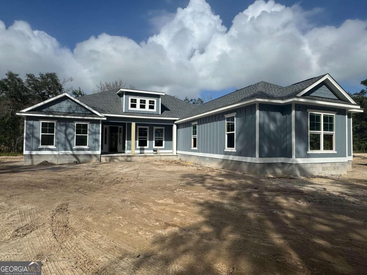 a front view of a house with yard